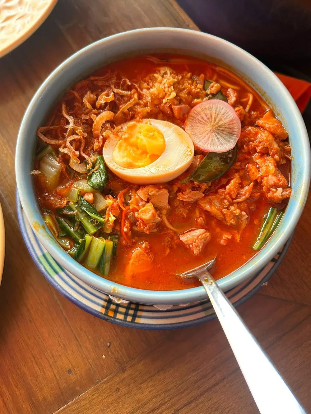 A bowl of spicy noodle soup